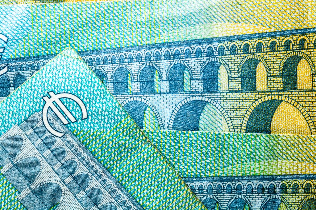Closeup of EURO banknotes details - world money, inflation and economy concept