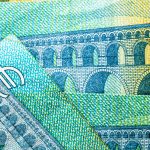 Closeup of EURO banknotes details - world money, inflation and economy concept
